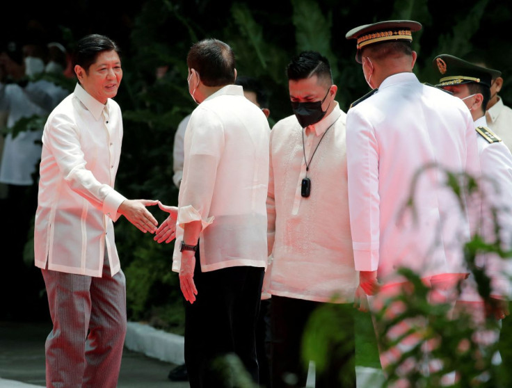 Incoming Philippine President Ferdinand 'Bongbong' Marcos Jr. shakes hands with outgoing President Rodrigo Duterte during the inauguration ceremony, at the Malacanang palace grounds, in Manila, Philippines, June 30, 2022. Francis R. Malasig/Pool via REUTE