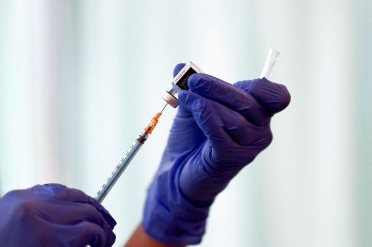 A medical worker fills a syringe with a dose of the Pfizer-BioNTech coronavirus disease (COVID-19) vaccine as Japan launches its inoculation campaign, at Tokyo Medical Center in Tokyo, Japan February 17, 2021. Behrouz Mehri/Pool via 