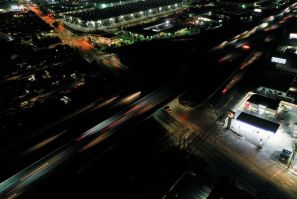 A nighttime view of vehicle traffic along the Interstate 405 (I-405) highway in Carson, California, U.S., March 11, 2022.  Picture taken with a drone and long exposure. 