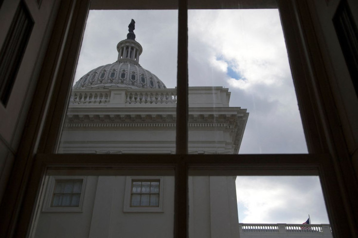 A general view of the U.S. Capitol dome as seen from a window outside the Senate chamber in Washington December 18, 2013.