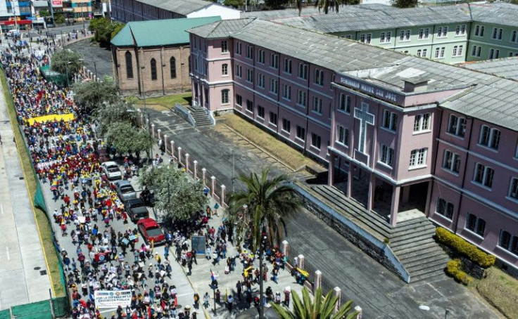 Thousands of Ecuadoran protesters gathered outside the negotiations venue in Quito