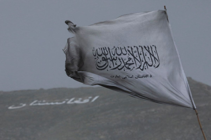 Taliban's flag is seen in a marketplace in Kabul, Afghanistan, May 10, 2022.