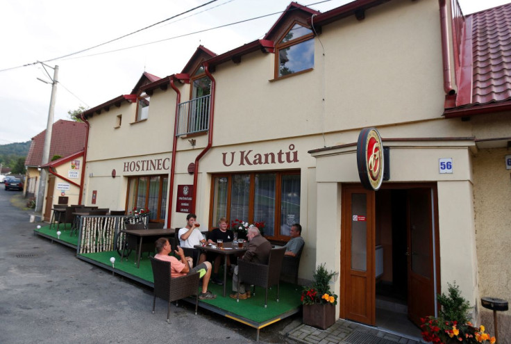 Customers drink beer in the U Kantu pub in the village of Myslovice near the town of Klatovy, Czech Republic, June 28, 2022. 