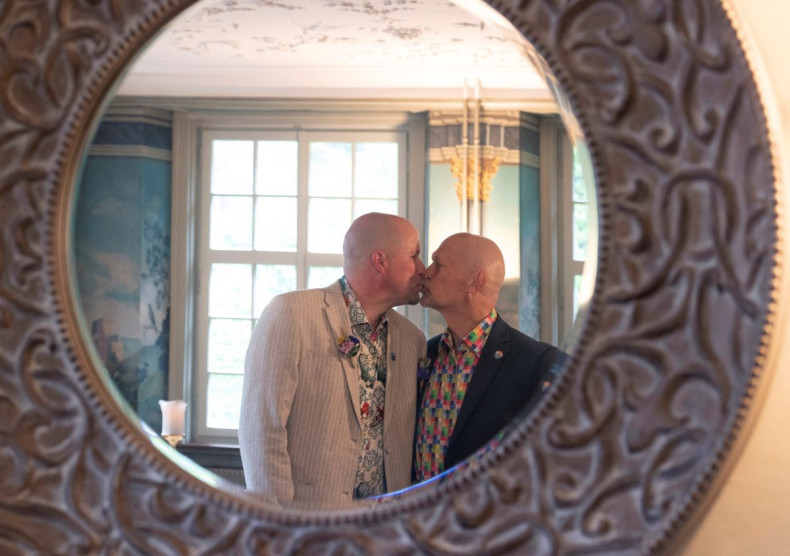 Alois Carnier and Peter Leu kiss each other after their wedding ceremony at the registry office in Schaffhausen, Switzerland July 1, 2022.  