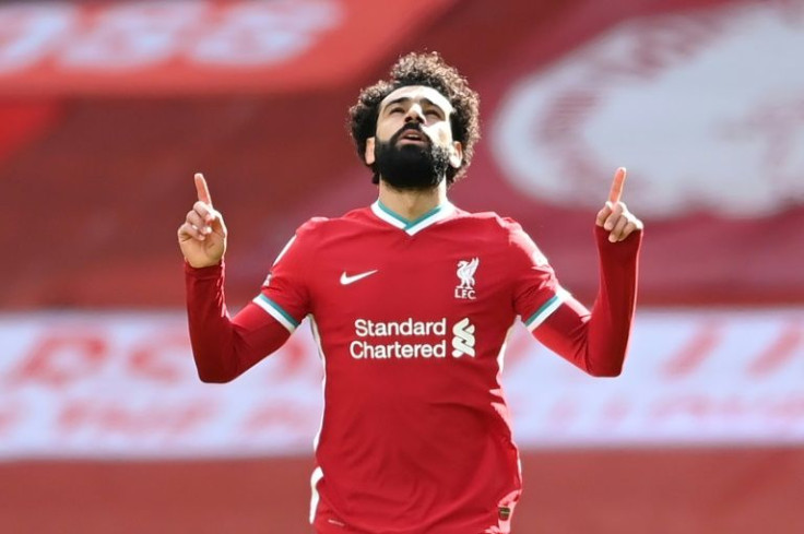 Going nowhere: Mohamed Salah committed his future to Liverpool by signing a new contract on Friday