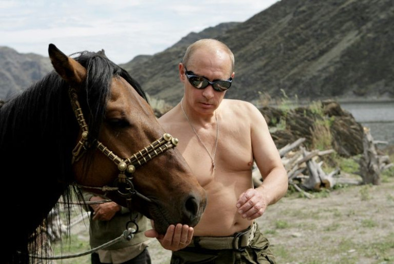 What a man: Russian Prime Minister Vladimir Putin in one of his famous bare-chested poses from Siberia in 2009