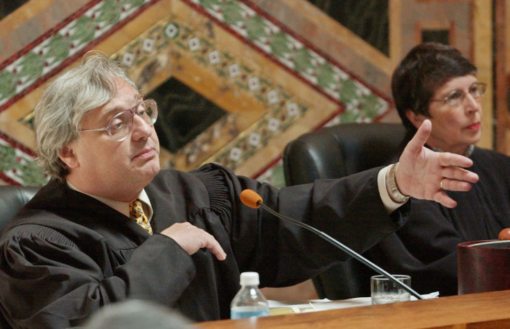 Judge Alex Kozinski, of the 9th U.S. Circuit Court of Appeals, gestures during oral arguments in San Francisco, September 22, 2003.   