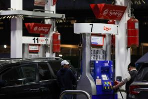 People pump gas at an Exxon gas station in Brooklyn, New York City, U.S., November 23, 2021. 