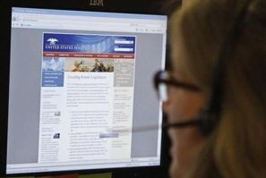 A journalist checks the Senate's website after it was attacked by internet hackers in Washington June 13, 2011.