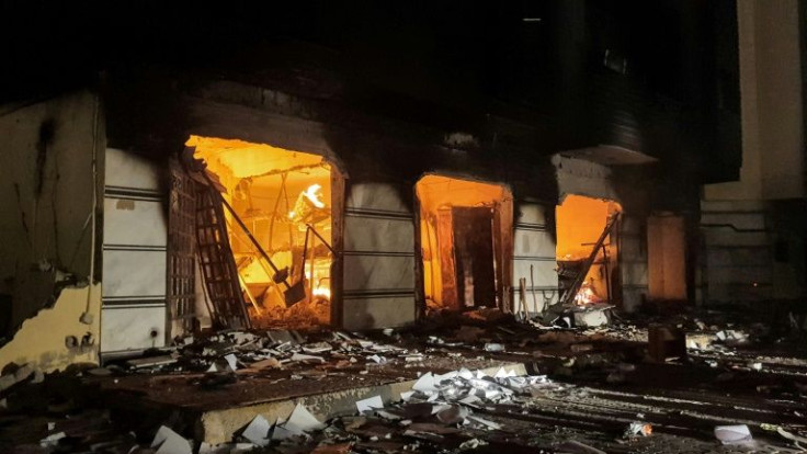 Protesters ransack the Libyan parliament building's offices and set fire to some of them after breaking through the perimeter on Friday evening