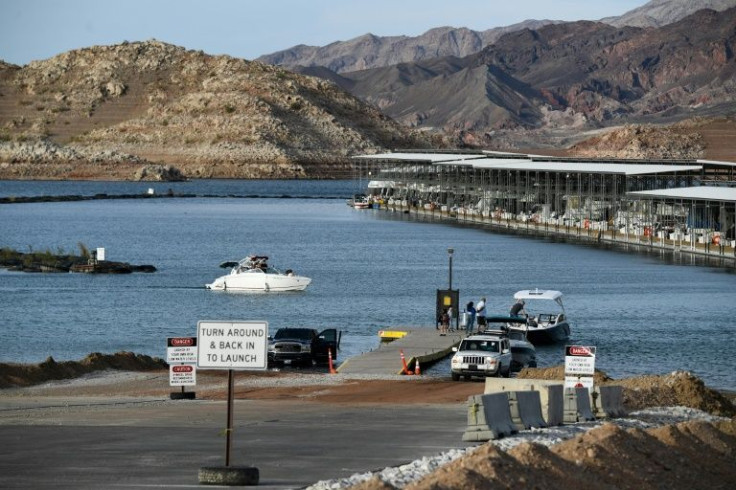 Visitors launch boats from a ramp extended multiple times as a result of worsening low water levels due to the western drought at the Lake Mead Marina on the Colorado River in Boulder City, Nevada on May 5, 2022