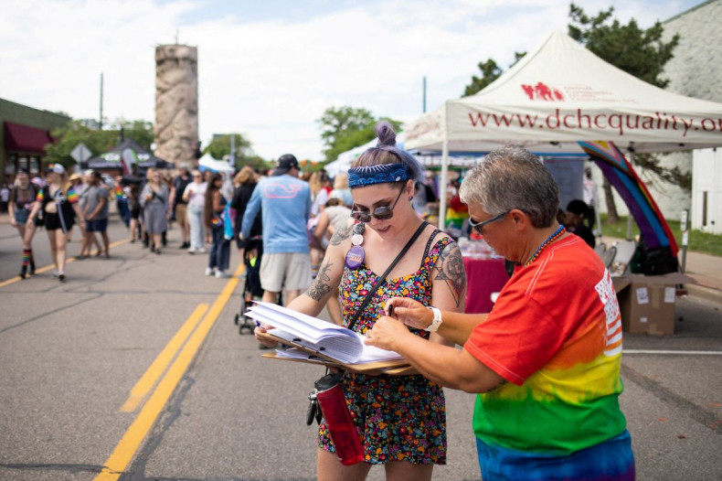 Volunteer Alex Cascio gathers signatures for a proposed abortion amendment at Ferndale Pride in Ferndale, Michigan, U.S., June 4, 2022. 