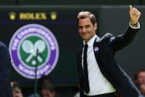 I'll be back? Roger Federer waves to the Centre Court crowd