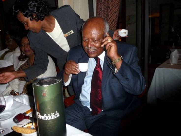 Tsegaye Tadesse, former Reuters Correspondent, talks on a mobile phone during his retirement party in Nairobi, Kenya, January, 2010. Reuters/Daniel Wallis