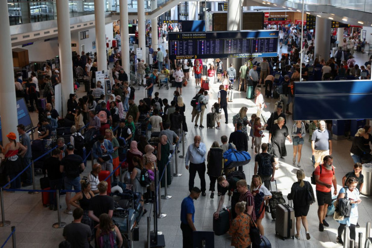 Travellers are seen at Copenhagen Airport Kastrup in Copenhagen, Denmark, July 3, 2022. 