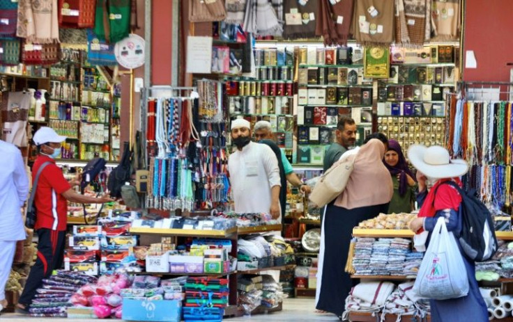 Muslim pilgrims shop at a market in Mecca -- the hajj is welcoming its first international visitors since 2019