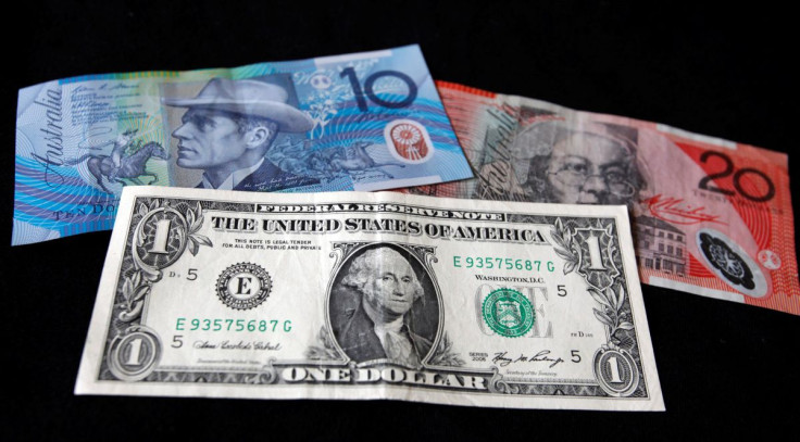 A U.S. dollar note (bottom) is pictured alongside an Australian 10 dollar (L) and 20 dollar bill in this picture illustration taken in Washington, October 14, 2010.  