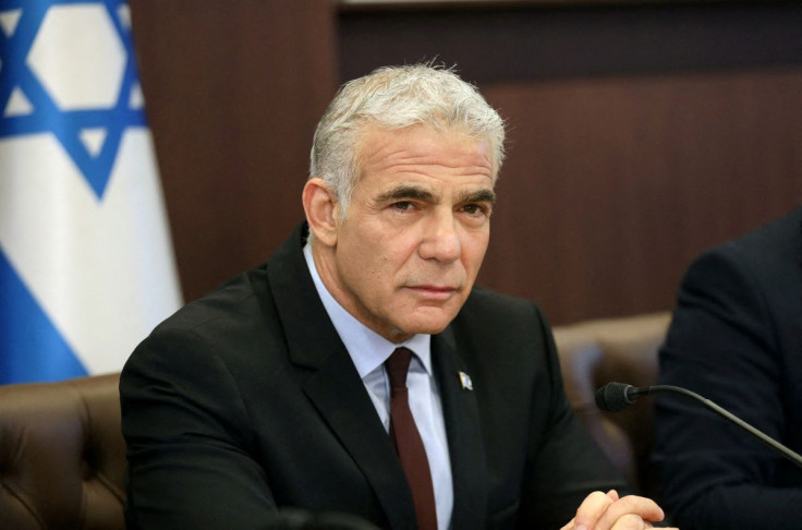 Israel's interim Prime Minister Yair Lapid chairs the first cabinet meeting, days after lawmakers dissolved parliament, in Jerusalem July 3, 2022. Gil Cohen-Magen/Pool via REUTERS