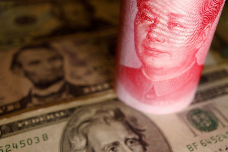 U.S. Dollar and Chinese Yuan banknotes are seen in this illustration picture taken June 14, 2022.