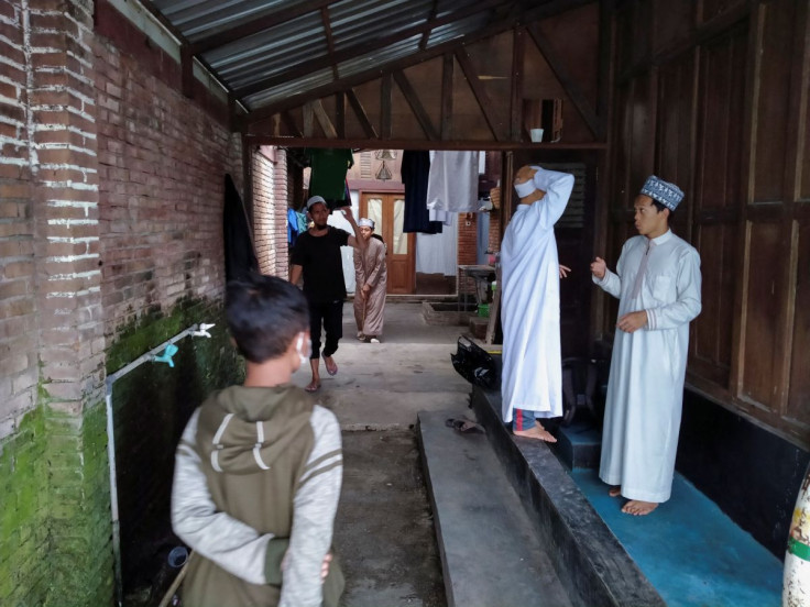 Students prepare to attend a class at a boarding school for hearing-impaired children, where they learn the holy scripture of Koran and recite in sign language, in Yogyakarta, Indonesia, July 4, 2022. 