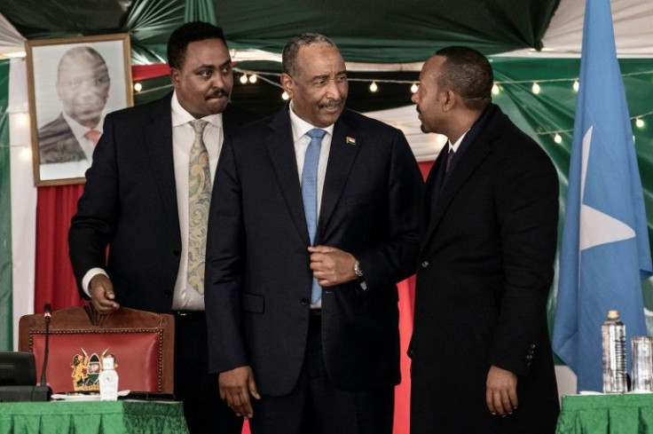 Al-Burhan and Ahmed, centre and right, met in Nairobi on Tuesday. Behind them is IGAD's executive secretary, Workneh Gebeyehu