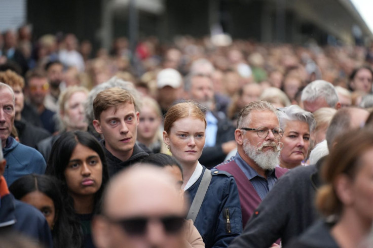 People attend a memorial service in front of the shopping center Field's in Copenhagen, Denmark July 5, 2022. Ritzau Scanpix/Emil Helms via REUTERS