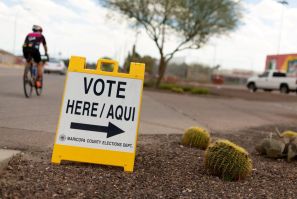 A sign points voters to a voting center for the Democratic primary in Sun City, Arizona, U.S., March 17, 2020.  