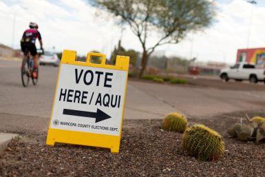 A sign points voters to a voting center for the Democratic primary in Sun City, Arizona, U.S., March 17, 2020.  