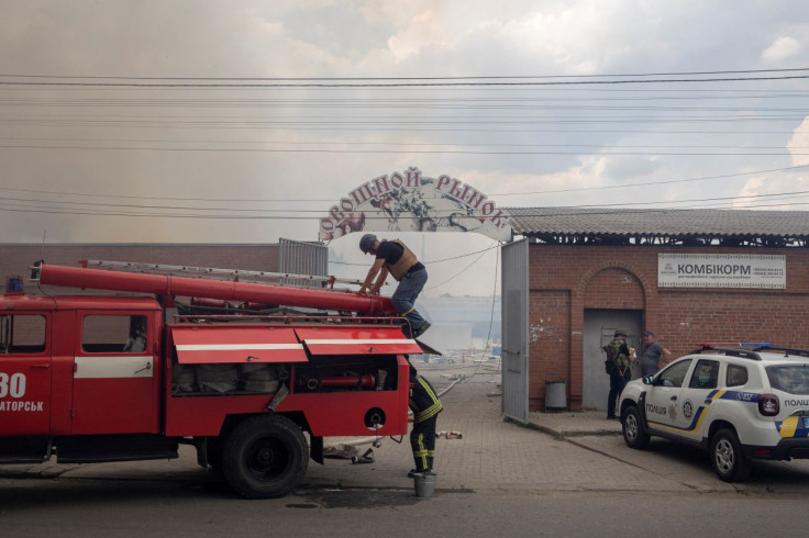 Firefighters work to extinguish a fire at the market after shelling, as Russia's attack on Ukraine continues, in Sloviansk, Donetsk region, Ukraine, July 5, 2022. 