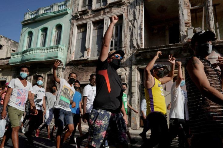 Protesters shout slogans against the government during a demonstration, which also involved counter-protesters who are in support of the government, amidst the coronavirus disease (COVID-19) outbreak, in Havana, Cuba July 11, 2021.