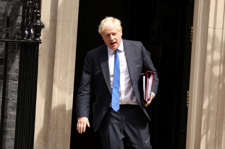 British Prime Minister Boris Johnson walks at Downing Street in London, Britain July 6, 2022. 