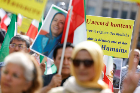 Supporters of the National Council of Resistance of Iran (NCRI) take part in a protest, in Brussels, Belgium July 6, 2022. The banner reads "Shameful deal". 