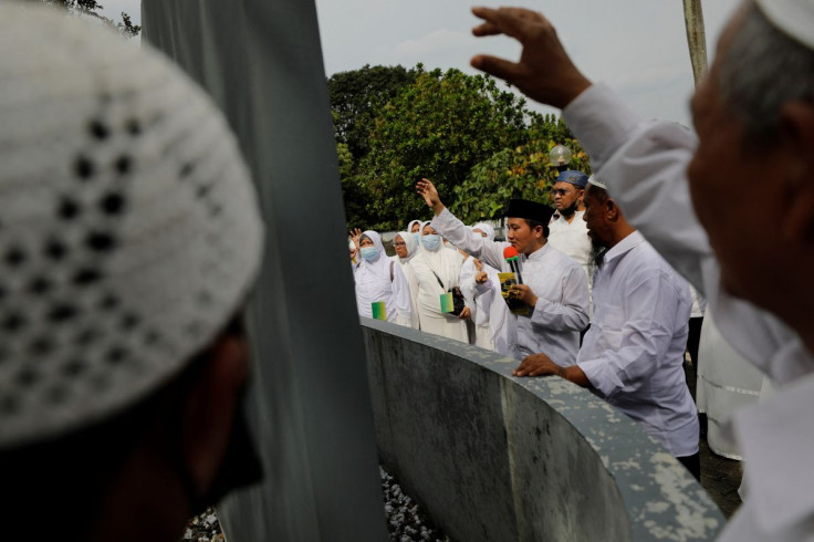Nur Illahi Rabbani, 39, leads in a Jamratul Aqabah practice, a stoning ritual for the haj, at the Pondok Gede Hajj dormitory, in Jakarta, Indonesia, May 24, 2022. Under the quota system Saudi Arabia uses, the average wait to complete the haj for people in