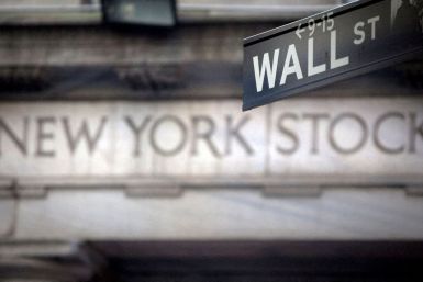 A Wall Street sign is pictured outside the New York Stock Exchange in New York, October 28, 2013. 