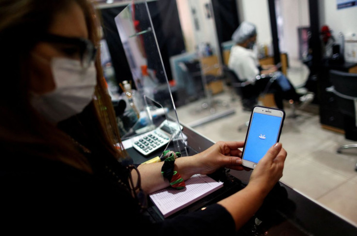 A woman uses the app Mercado Pago, in her store in Buenos Aires, Argentina. October, 15 2020.