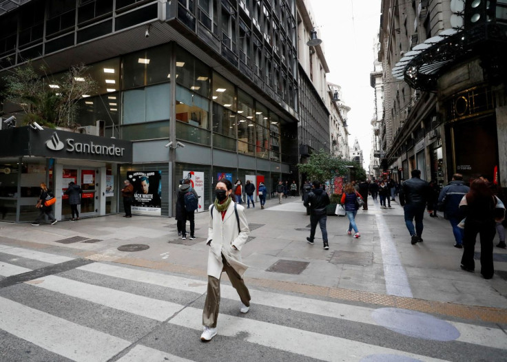 People walk in downtown Buenos Aires, Argentina, July 4, 2022. 