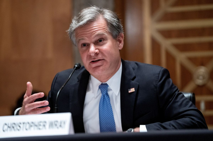 FBI Director Christopher Wray testifies during a Senate Homeland Security and Governmental Affairs hearing to discuss security threats 20 years after the 9/11 attacks, in Washington, D.C., U.S. September 21, 2021. Greg Nash/Pool via
