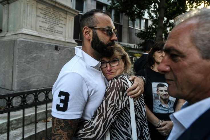 Family members of victims gathered outside the Genoa courthouse