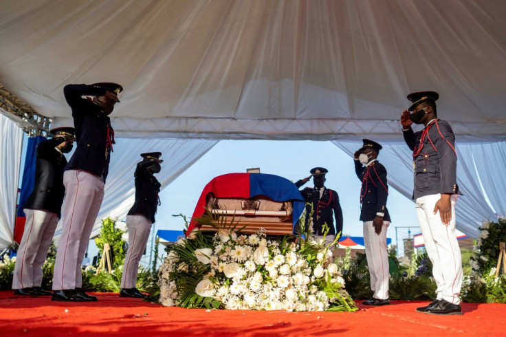 Presidential honor guards salute in front of the coffin of late Haitian President Jovenel Moise, who was shot dead earlier this month, during the funeral at his family home in Cap-Haitien, Haiti, July 23, 2021. 