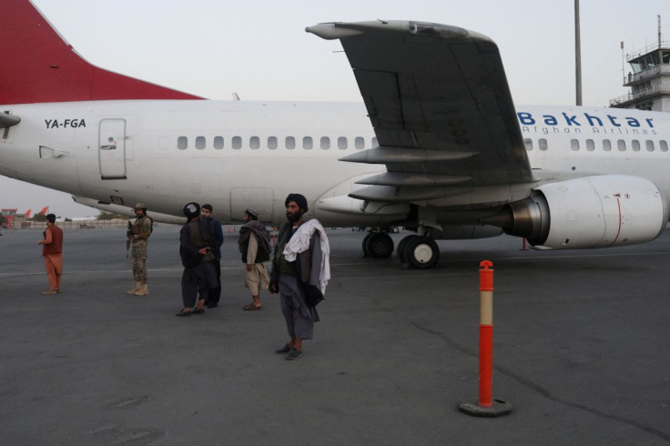 Members of the Taliban stand on the runway of the international airport in Kabul, Afghanistan, September 9, 2021. WANA (West Asia News Agency) via REUTERS ATTENTION EDITORS - THIS IMAGE HAS BEEN SUPPLIED BY A THIRD PARTY./File Photo