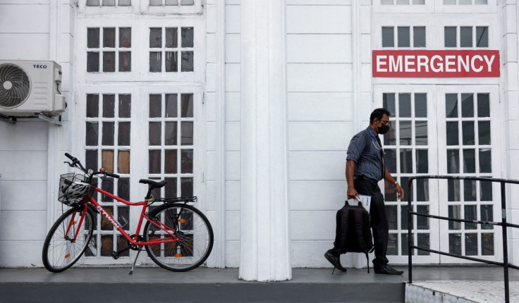 Thusitha Kahaduwa, a doctor (41), arrives to work after riding a bicycle due to major fuel shortage, amid the country's economic crisis, in Colombo, Sri Lanka, July 6, 2022.