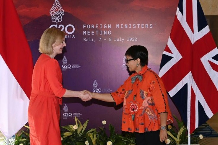 Indonesia's Foreign Minister Retno Marsudi shakes hand with Britain's Foreign Secretary Liz Truss during bilateral meeting for G20 Foreign Ministers Meeting in Bali
