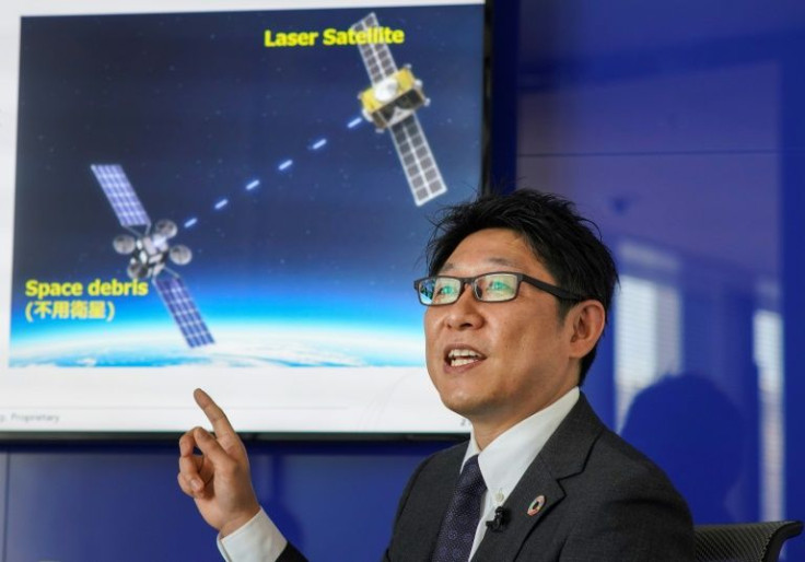Engineer Tadanori Fukushima of satellite operator SKY Perfect JSAT envisions using a laser beam to vaporise the surface of space debris