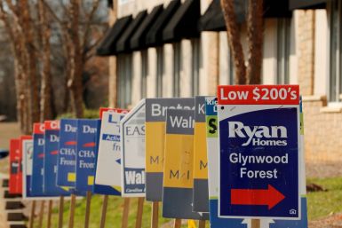 Real estate signs advertise new homes for sale in multiple new developments in York County, South Carolina, U.S., February 29, 2020. 