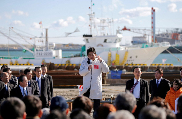 Japan's Prime Minister Shinzo Abe, who is also leader of the ruling Liberal Democratic Party (LDP), speaks to voters during his official campaign kick-off for the December 14 lower house election, at the Soma Haragama fishing port in Soma, Fukushima prefe