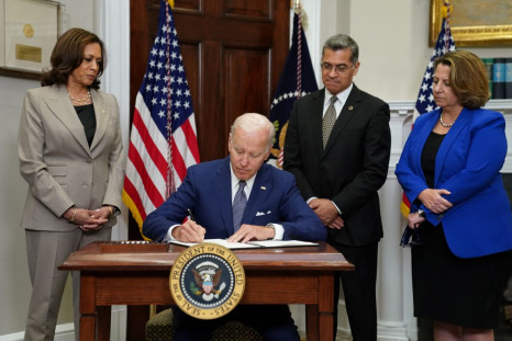 U.S. President Joe Biden signs an executive order to help safeguard women's access to abortion and contraception after the Supreme Court last month overturned Roe v Wade decision that legalized abortion, as Vice President Kamala Harris, Health and Human S