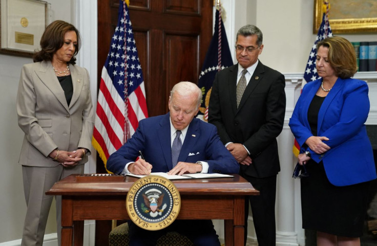 U.S. President Joe Biden signs an executive order to help safeguard women's access to abortion and contraception after the Supreme Court last month overturned Roe v Wade decision that legalized abortion, as Vice President Kamala Harris, Health and Human S