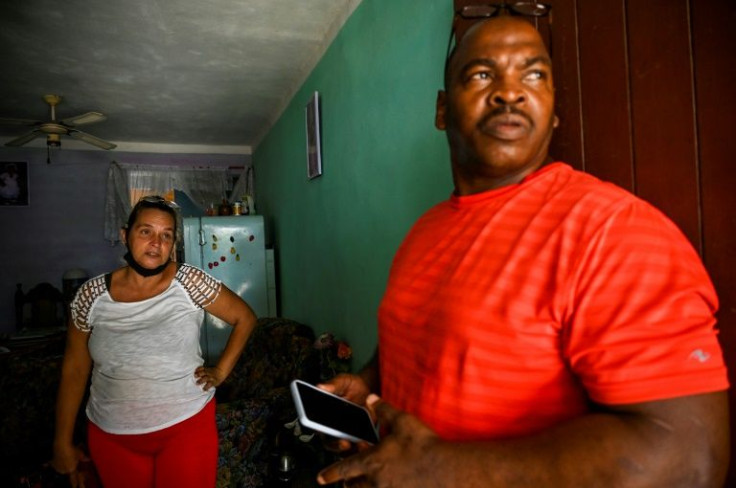 Elizabet Leon Martinez, who has had three children imprisoned for anti-government protests, and Luis Wilber Aguilar, whose son Wagniel Aguilar is also serving time for the same reason, are seen in the neighborhood of La Guinera on the outskirts of Havana