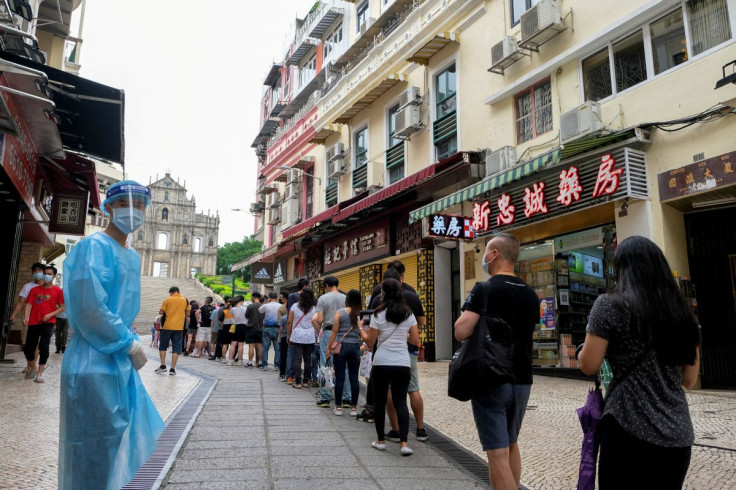 People queue for the mass coronavirus disease (COVID-19) testing near the Ruins of Saint Paul's in Macau, China June 20, 2022.