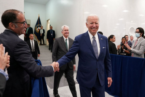 U.S. President Joe Biden is welcomed by Central Intelligence Agency employees during his visit to CIA Headquarters in Langley, Virginia, U.S., July 8, 2022. 